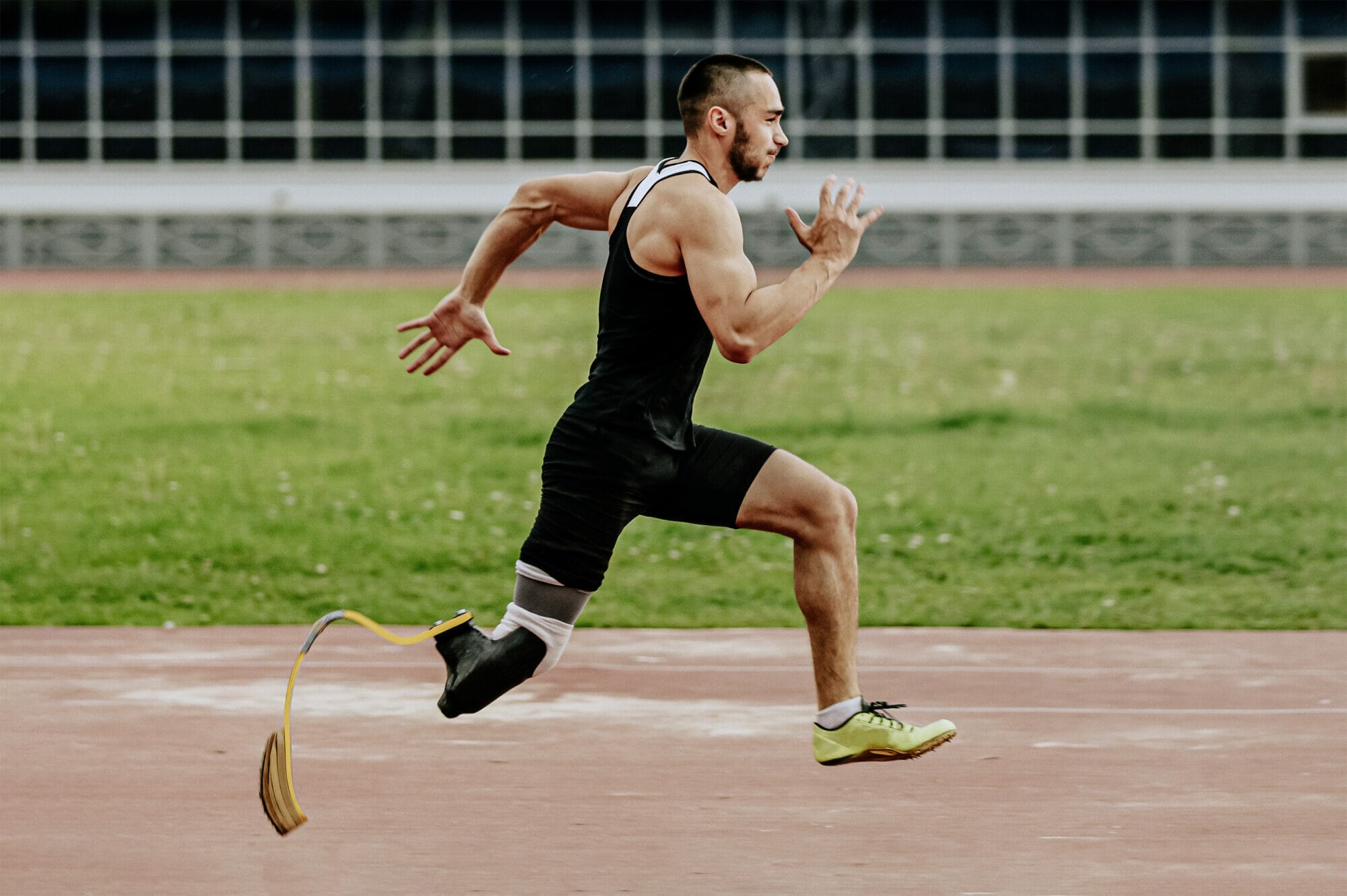 Athlete with prosthetic leg overcoming barrier with determination and strength